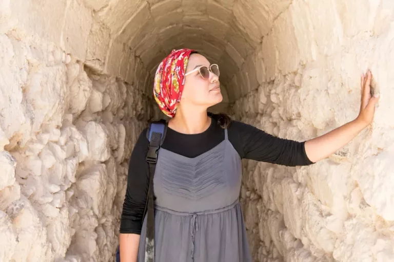 About Messiah - A woman walks through an ancient tunnel in Jerusalem